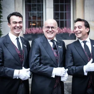 Drie butlers van The Grand Amsterdam