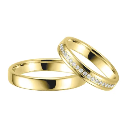 Klassieke gouden trouwringen van Aller Spanninga – geelgouden ringen met briljanten voor hem en haar, tijdloos design voor een elegante bruiloft.