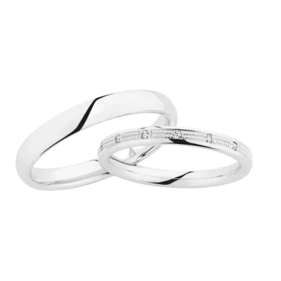 Witgouden trouwringen van Christian Bauer – klassieke ringen met diamantaccenten en verfijnde gravure, tijdloos en elegant voor bruiloften.
